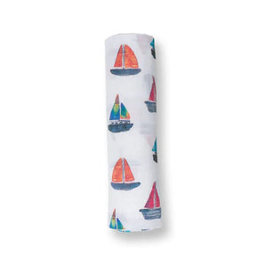 Lulujo Inc.s Cotton Swaddle featuring a colorful sailboats print.