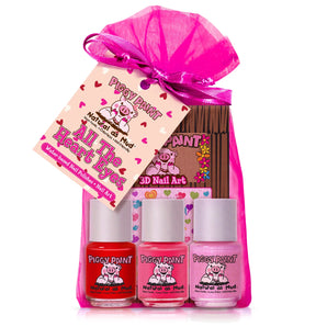 Three bottles of Piggy Paint nail polish in pink bag with All the Heart Eyes and 3D Nail Art tag.