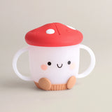 Itzy Ritzys Itzy Snack Cup is a mushroom-shaped sippy with a silicone lid, red top, smiley face, dual handles; dishwasher-safe!.