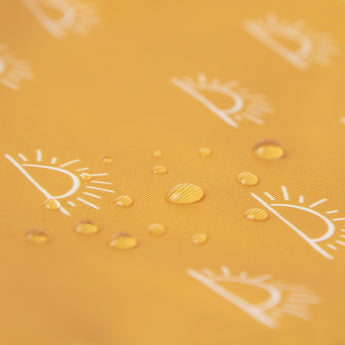 Close-up of water droplets on Bumkins Wet Bag: Sunshine.