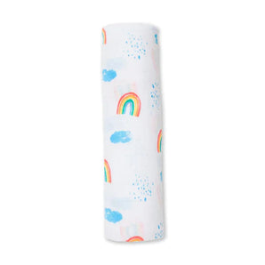 Lulujo Inc.s Cotton Swaddle, Rainbow Sky is a premium muslin with colorful rainbows and blue clouds, perfect for versatile baby blankets.