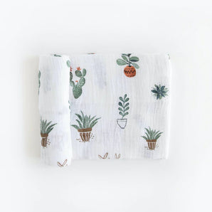 Little Unicorns Cotton Swaddle in Prickle Pots features hand-painted potted plant prints.