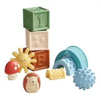 The Itzy Ritzy Itzy Blocks collection features colorful baby toys, including squishy-soft blocks, a smiling sun, a mushroom, and a hedgehog. With blue and yellow sensory textures, these toys add fun to storytelling for little ones.