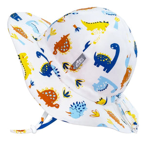 Jan and Jul Sun Hat, Dino Kids: white cotton floppy hat with dinosaur print, 50+ UPF, wide brim, and secure chin strap.