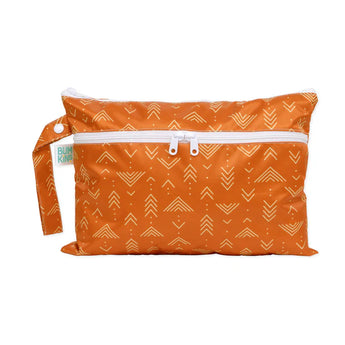 Bumkins Wet/Dry Clutch: Grounded features a waterproof fabric with white geometric arrows, zip closure, and side handle loop.