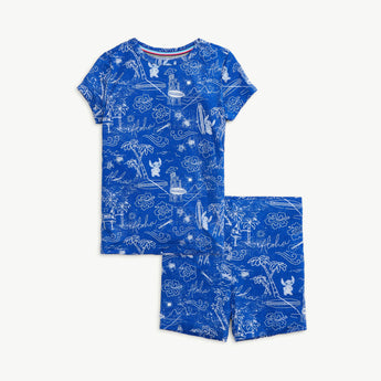 Magnetic Mes Lilo+Stitch blue short-sleeve pajama set features tropical surfboard and palm tree sketches.