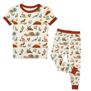 Emerson and Friends PJs, Desert Friends feature wildlife prints with rabbits, birds, and cacti, accented by red trim.