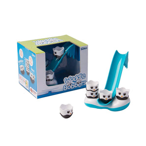 The Waddle Bobbers Bath Toy by Fat Brain Toy Co features floating penguins on an iceberg slide.