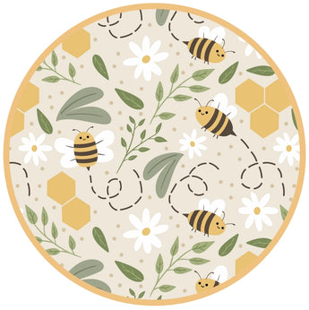 A circular illustration features the Happy Honey Bees pattern from Emerson and Friends Sundress, showcasing bees, white flowers, and honeycombs on a beige background. Dashed bee flight lines add a playful vibe akin to swaying bamboo sundresses.