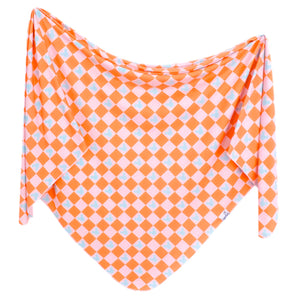 The Copper Pearl Knit Swaddle Blanket features a vibrant Mickey Mouse check in orange, white, and light blue accents.