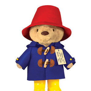 The Lovedbaby Plush Paddington Bear with Boots features a red hat, blue coat, yellow boots, and a tag, set against a white backdrop.