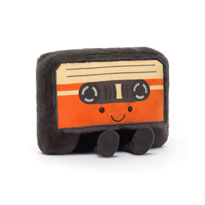 The Jellycat Amuseables Cassette Tape is a beige and orange retro plush with a happy face and quirky feet.