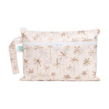 Bumkins Wet/Dry Clutch: Palm Daze is a waterproof beige pouch with a palm tree pattern, side handle, and white zipper.