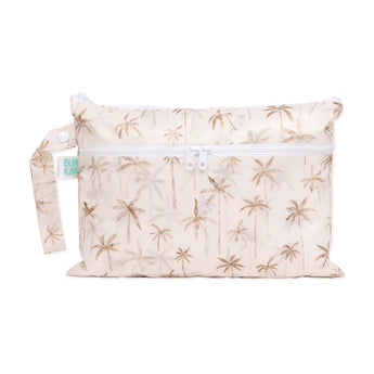 Bumkins Wet/Dry Clutch: Palm Daze is a waterproof beige pouch with a palm tree pattern, side handle, and white zipper.