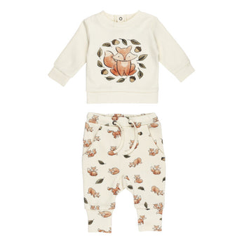 Lovedbabys Organic Sweatshirt & Jogger Set, Foxy, includes a cream top with a charming fox and leaf design and matching pants featuring an all-over print of small foxes and leaves. Made from organic cotton with eco-friendly dyes, the pants have a drawstring waist for comfort.