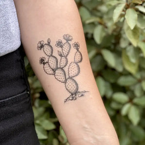 The NatureTats Prickly Pear temporary tattoo features a cactus with flowers against lush green leaves.