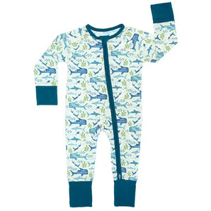 The Emerson and Friends Sleeper, Shark Friends is a light blue baby onesie with vibrant ocean-themed illustrations of sharks, whales, and seaweed. Made from buttery soft bamboo, it features a two-way zipper for convenience and dark teal cuffs on the sleeves and ankles.