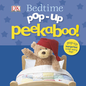 Childrens book cover: Pop-Up Peekaboo! Bedtime Board Book, by Random House. A teddy in a red hat peeks from a quilted bed.