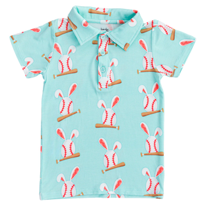 The Baseball Bunnies Polo Shirt by Birdie Bean is a light blue childrens shirt with a baseball with bunny ears pattern. Crafted from breathable fabric, it boasts vibrant colors and playful sports with a classic collar and three-button design.