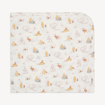 The Magnetic Me Moments with Friends Blanket is a light-colored baby blanket made from eco-friendly TENCEL™ modal, featuring playful cartoon animals like bears, tigers, and donkeys. Its perfect as a stroller blanket for your little ones adventures.