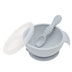 Bumkins Silicone First Feeding Set: Gray includes a bowl with suction base and a matching spoon for easy self-feeding and spill prevention.