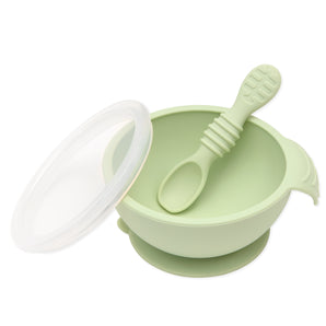 Bumkins Silicone First Feeding Set in Sage includes a suction bowl with matching spoon and transparent lid.