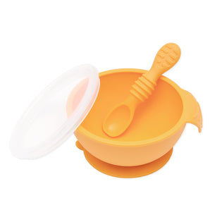 Bumkins Silicone First Feeding Set: Tangerine baby bowl with lid, spoon, and suction base for self-feeding.