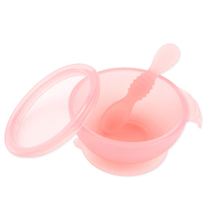 Bumkins Silicone First Feeding Set: Pink Jelly—includes a pink bowl with suction base, LFGB-grade silicone lid, and textured spoon.