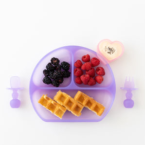 Bumkins Silicone Grip Dish: Purple Jelly holds waffles, berries in a heart-shaped bowl with yogurt and toddler utensils nearby.