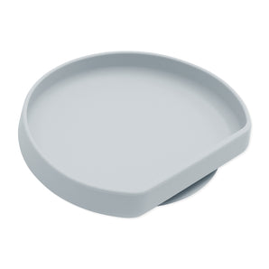 The Bumkins Silicone Grip Plate: Gray is a minimalist, round snack tray with a raised edge and open section, made from food-safe silicone.