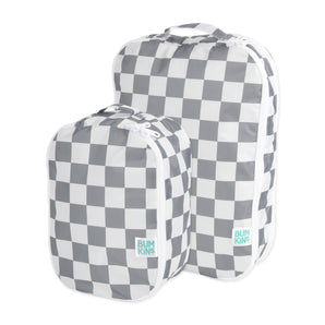 Two packing cubes: large and small, in waterproof checkered fabric with the Bumkins logo. Product: Charcoal Check Packing Cube 2 Pack.