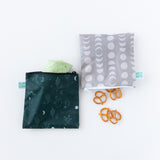 Bumkins Reusable Snack Bag, Large 2 Pack: Desert Night—dark green with cacti & gray with moon phases, both with durable zippers.