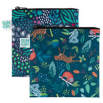 The Bumkins Reusable Snack Bag, Large 2-Pack features vibrant jungle and animal prints with durable zippers. One bag has abstract leaves and spots; the other showcases koalas and giraffes in colorful foliage. Both bags are waterproof with Bumkins labels.