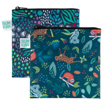 The Bumkins Reusable Snack Bag, Large 2-Pack features vibrant jungle and animal prints with durable zippers. One bag has abstract leaves and spots; the other showcases koalas and giraffes in colorful foliage. Both bags are waterproof with Bumkins labels.