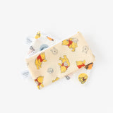 The Bumkins Reusable Snack Bag, Small 2 Pack: Pooh Bear and Friends features two cream-colored pouches with playful Winnie the Pooh prints and a honey jar on waterproof fabric. These charming bags include Disney tags and stand out beautifully against a white backdrop.