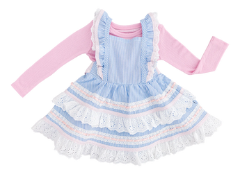 The Birdie Bean Seersucker Linen Birdie Twirl Set is a charming two-piece featuring a pink long-sleeve shirt and a blue-and-white striped seersucker dress adorned with lace details and ruffled layers for a playful look.