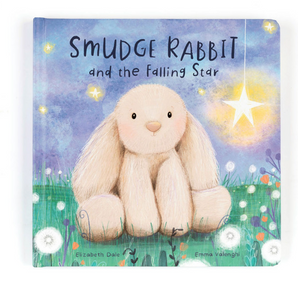 The cover of Jellycat, Smudge Rabbit and the Falling Star Book by Elizabeth Dale and Emma Valenghi shows a fluffy rabbit on grassy land with flowers under a starry sky featuring a glowing star, making it an ideal bedtime story.