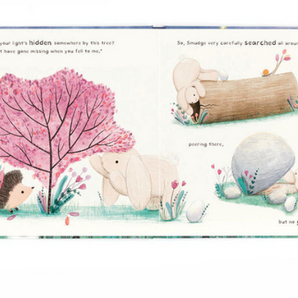 In Jellycats Smudge Rabbit and the Falling Star Book, a hedgehog tells Smudge Rabbit about losing something by a pink tree. Smudge searches around the log and rock, but cant find it.