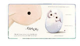 The Jellycat, Smudge Rabbit and the Falling Star Book by Jellycat features a pink bunny gazing at a hatching egg. An owl chick with big eyes and fluffy feathers emerges, surrounded by text narrating this delightful bedtime tale.