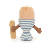 Meet the delightful Jellycat creation, Amuse Eggetha Egg & Lance Soldier: a plush toy resembling a soft-boiled egg in a striped blue and white cup. A brown arm holds a fluffy toast-shaped object, with Eggethas top slightly open to reveal her cheerful yellow yolk inside.