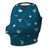 The Milk Snobs Cover Star Wars the Child is a multifunctional blue baby car seat accessory with space-themed illustrations, including stars, planets, and an alien. The words Precious Cargo repeat across its design, making it ideal for use as a nursing cover too.