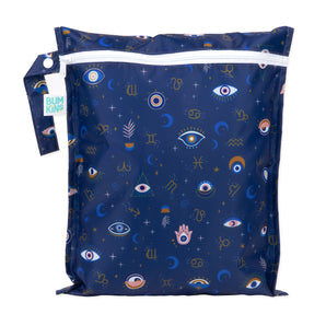 Bumkins Wet Bag: Evil Eye is made of blue waterproof fabric with a design of eyes, crescent moons, and zodiac symbols.