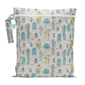 The reusable Bumkins Wet Bag: Cacti has a colorful cactus pattern with potted cacti on waterproof fabric and a light background.