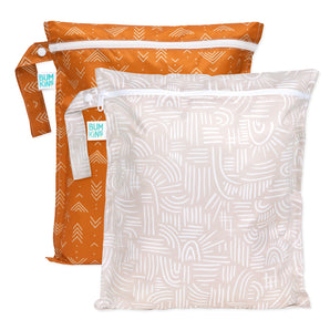 Bumkins Wet Bag 2 Pack: Wander + Grounded, with waterproof, zipped bags in orange arrow and beige abstract designs.