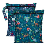 Two Bumkins wet bags with jungle animal prints, featuring sloths, koalas, and toucans in waterproof fabric.