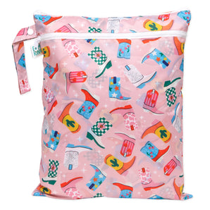 A pink Bumkins Wet/Dry Bag: Boots has colorful cowboy boot designs in red, blue, and green on waterproof fabric.