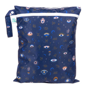 Bumkins Wet/Dry Bag: Evil Eye features celestial prints with stars, moons, and zodiac signs on waterproof dark blue fabric.