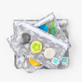 Bumkins Clear Travel Bag 3 Pack: Lunar Phase are stacked on a white background, filled with colorful play dough and cookie cutters.