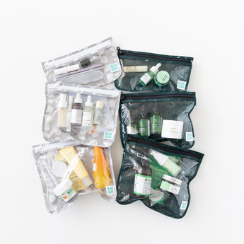 Bumkins Clear Travel Bag 3 Pack: Lunar Phase is filled with skincare items and showcased on a white background next to other similar bags.