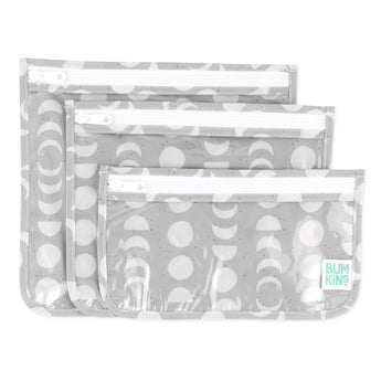 Bumkins Clear Travel Bag 3 Pack: Lunar Phase includes three TSA-compliant pouches with a white lunar phase design on gray waterproof fabric.